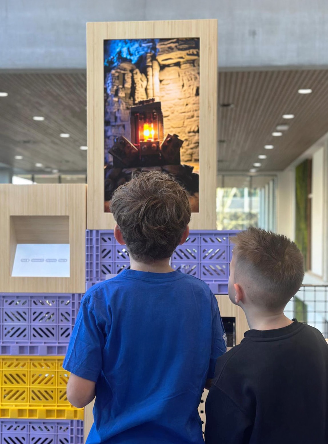 Two boys looking at their spooky Lego castle render on a Lego League event.