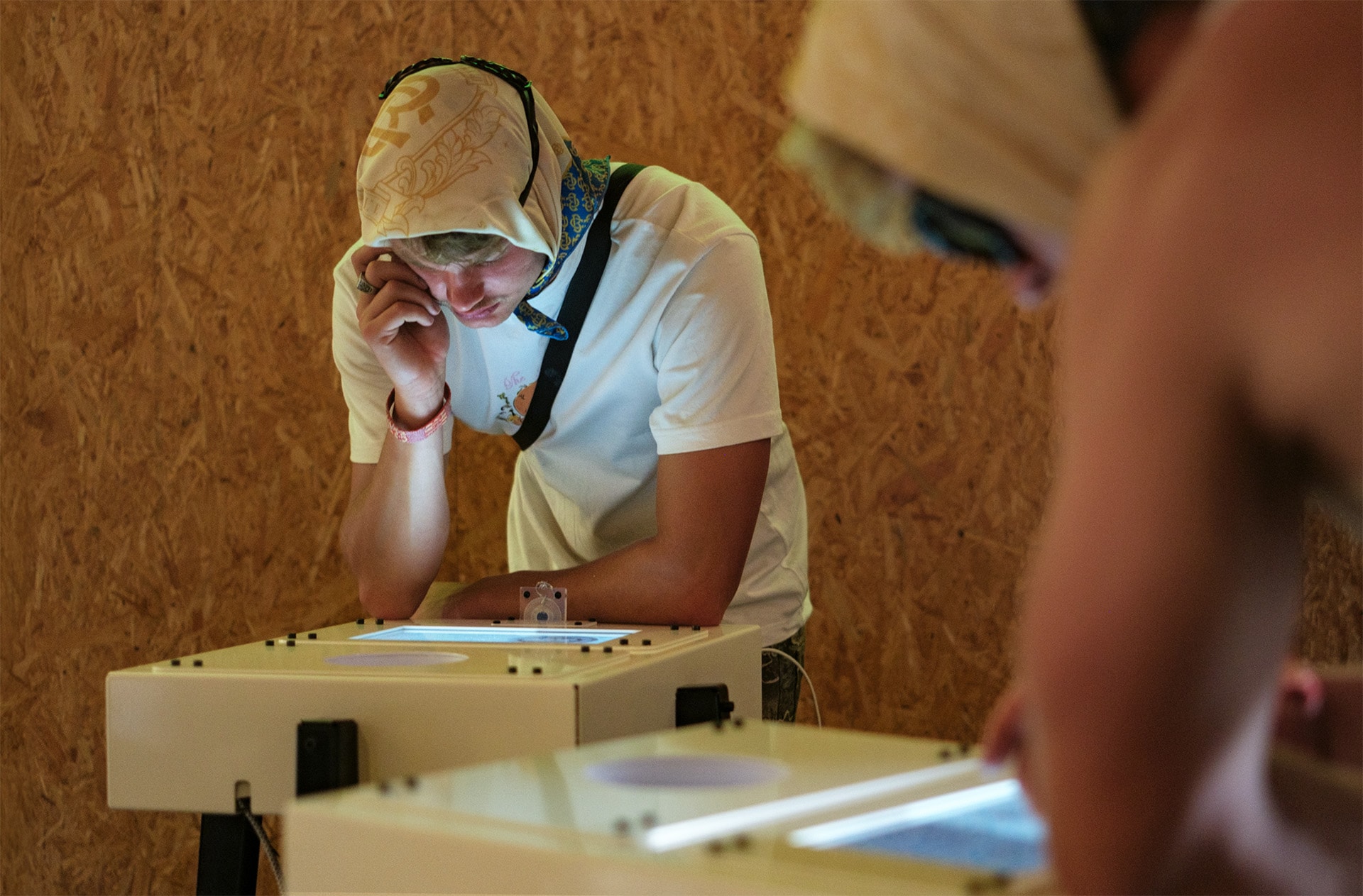 A man standing in front of an interactive object.