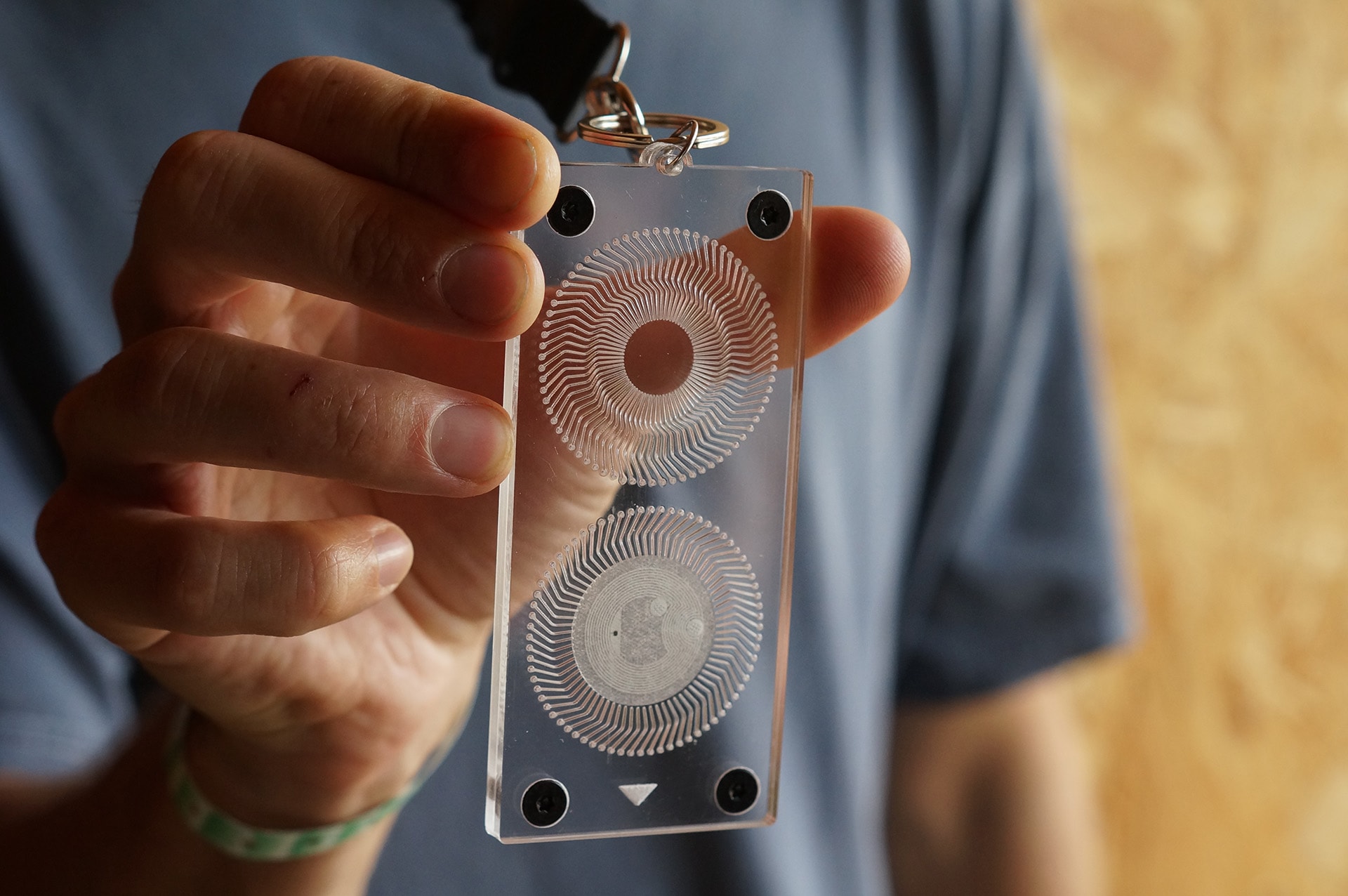 Man holding object on a keycord